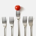 red cherry tomato fork against white background Royalty Free Stock Photo