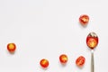 Red cherry tomato and spoon on white background Royalty Free Stock Photo
