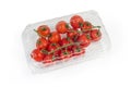 Red cherry tomatoes on branches in closed plastic sale packaging