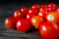 Red Cherry Tomatoes closeup on dark wood Royalty Free Stock Photo