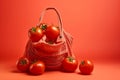 red cherry tomatoes an open string bag and tomatoes in it studio lighting photography with space for copy Royalty Free Stock Photo