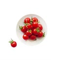 Red cherry tomatoes on a plate isolated