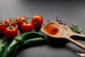 Cherry tomatoes, rosemary, peppercorns, wooden spoons