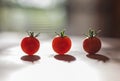 Red Cherry Tomatoes on the wooden background with the drop shadows Royalty Free Stock Photo