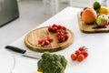 Red cherry tomatoes on wooden cutting board Royalty Free Stock Photo