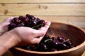 Red cherry in a wooden bowl Royalty Free Stock Photo