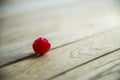 Red cherry on wooden floor