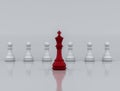 A red chess king stands at the front leading a white chess piece, 3d illustration Royalty Free Stock Photo