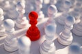 Red chess pawn among white pawns . Leadership concept. 3d rendering Royalty Free Stock Photo