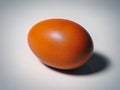 Red chicken egg close up on light background Royalty Free Stock Photo