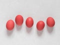 Red chicken eggs on a white background. Easter concept. Minimalism. Top view. Copy space Royalty Free Stock Photo