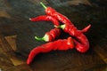 Red chile peppers on a wooden chopping board Royalty Free Stock Photo