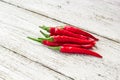 red chili or chilli cayenne pepper on white wooden table Royalty Free Stock Photo