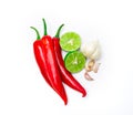 Red chili , garlic and lime lemon arrange on white background Royalty Free Stock Photo