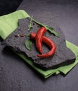 red chili pepper on black slate