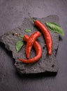 red chili pepper on black slate