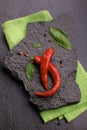 red chili pepper on black slate