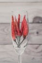 Red chili pepper inside wine glass