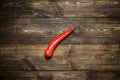 Red chili pepper on plate on wooden background Royalty Free Stock Photo