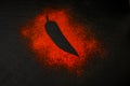 Red chili pepper silhoutte isolated on black slate board. Top view. Royalty Free Stock Photo
