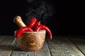 Red chili pepper in wooden mortar . Royalty Free Stock Photo