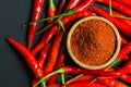 Red chili peppers and chili flakes Royalty Free Stock Photo