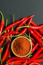 Red chili peppers and chili flakes Royalty Free Stock Photo