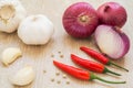 Red chili peppers, garlic and red onion Royalty Free Stock Photo