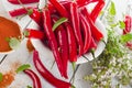 Red chili peppers with herbs leaves Royalty Free Stock Photo