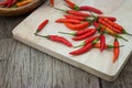 Red chili Peppers on wood chopping background Royalty Free Stock Photo