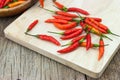 Red chili Peppers on wood chopping background Royalty Free Stock Photo