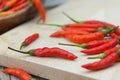 Red chili Peppers on wood chopping background Royalty Free Stock Photo