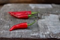 Red chili peppers on a wooden table