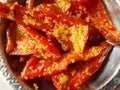 Red Chili Pickle.Acharya red chilli in a steel dish.