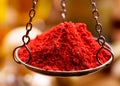 Red chili powder in vintage bowl weights Royalty Free Stock Photo