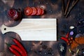 red chili and tomato, salt, garlic, rosemary on a dark wooden background ingredients for cooking cover cookbook asian cuisine,