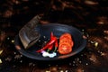 red chili and tomato, salt, garlic, rosemary on a dark wooden background ingredients for cooking cover cookbook asian cuisine,