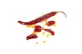 Red chilli exploded into small pieces with many seed inside and dried chili powder isolated on white background.