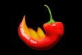 Red chilli pepper on fire on black Royalty Free Stock Photo