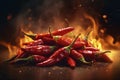 Red chilli peppers ablaze with fiery background