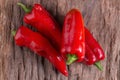 Red chilly pepper on wooden black background. Red hot chili peppers. Royalty Free Stock Photo