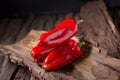 Red chilly pepper on wooden black background. Red hot chili peppers. Royalty Free Stock Photo