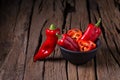 Red chilly pepper on wooden black background. Red hot chili peppers. Royalty Free Stock Photo