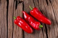 Red chilly pepper on wooden black background. Red hot chili peppers. Royalty Free Stock Photo