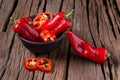 Red chilly pepper on wooden black background. Red hot chili peppers. Royalty Free Stock Photo