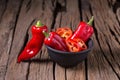 Red chilly pepper on wooden black background. Red hot chili peppers. Royalty Free Stock Photo