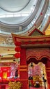 A red chinese building inside a mall