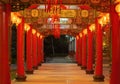 Red chinese column with lanterns hanging on wire outdoor lamps in temple of China Town decoration on Chinese New Year festival Royalty Free Stock Photo