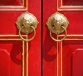 Red chinese door with a lion head. Royalty Free Stock Photo