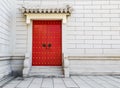 Red Chinese door with locked key and bronze lion head knob on co Royalty Free Stock Photo